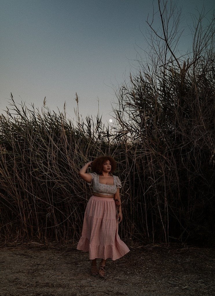 Moody Las Vegas Wetlands Sunset portraits with BIPOC model in pink skirt