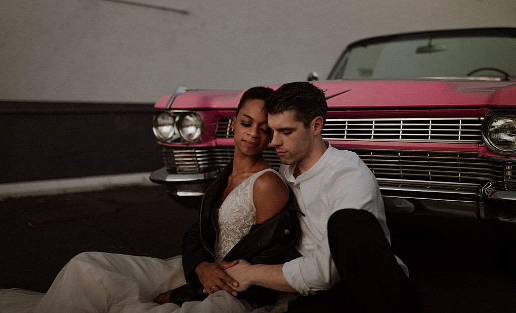 Intimate Las Vegas elopement with leather jacket and pink caddy