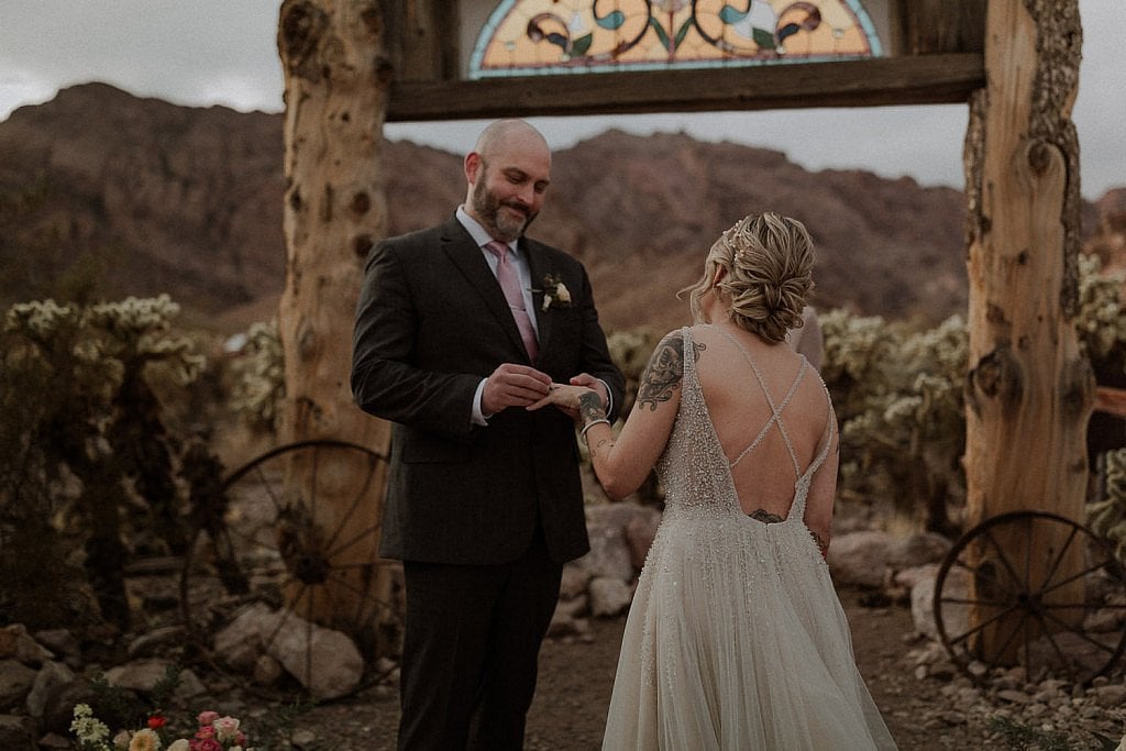 Groom gives bride her ring during El Dorado Intimate Wedding