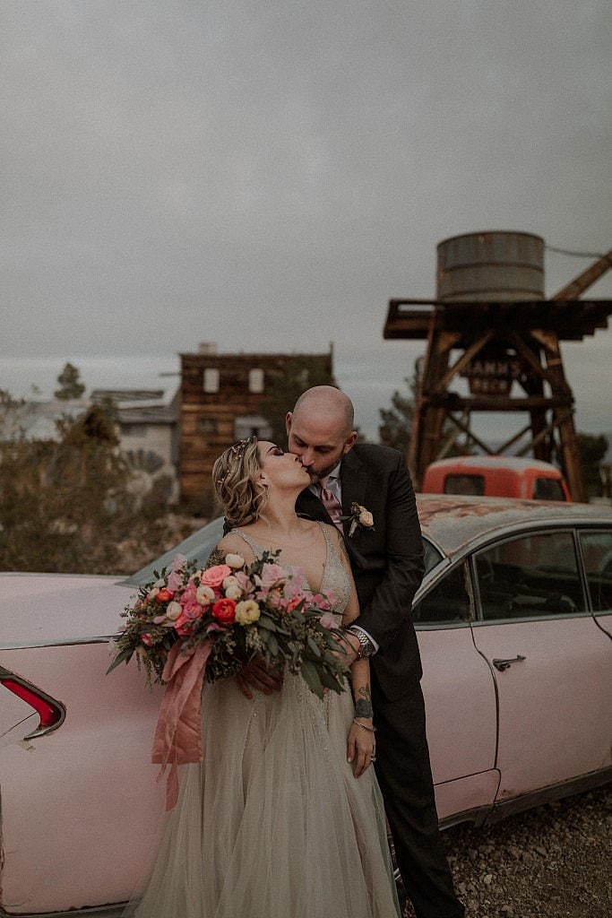 El Dorado Ghost Town Elopement Las Vegas at Sunset with spring flowers and pink cadillac