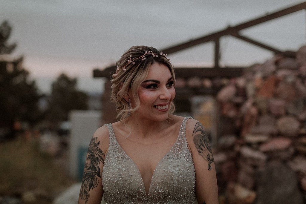 Bride smiles at groom after their intimate elopement ceremony in El Dorado Ghost Town Las Vegas