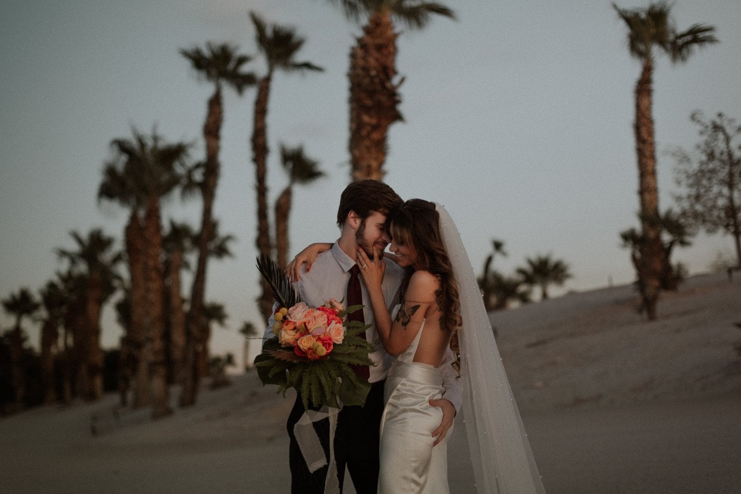 Intimate Las Vegas elopement on the beach at Bali Hai with tropical floral bouquet