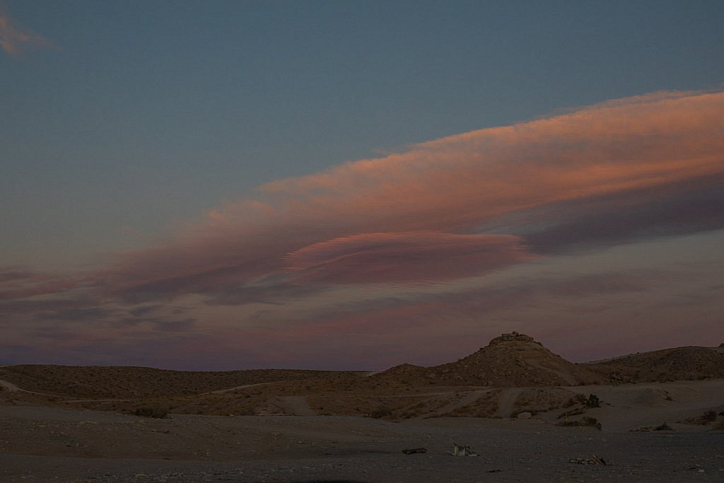 Beautiful evening sky with colorful sunset at the sand dunes on the west coast