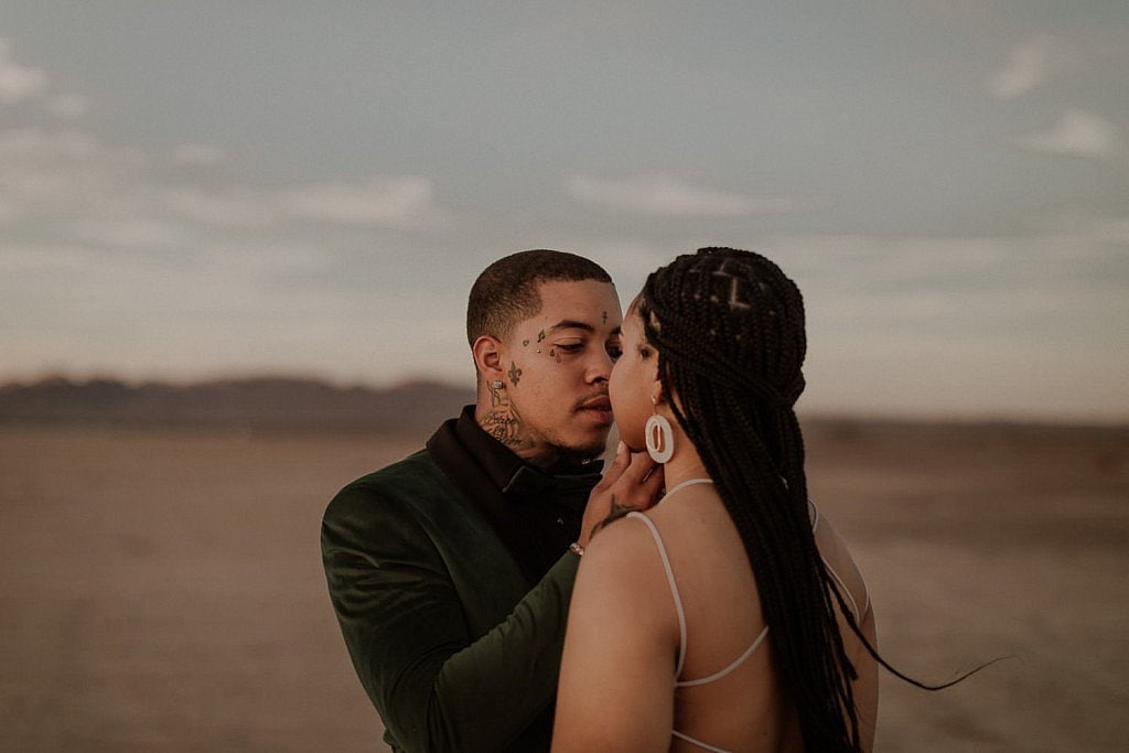 Elopement couple looks into each others eyes after their desert elopement.