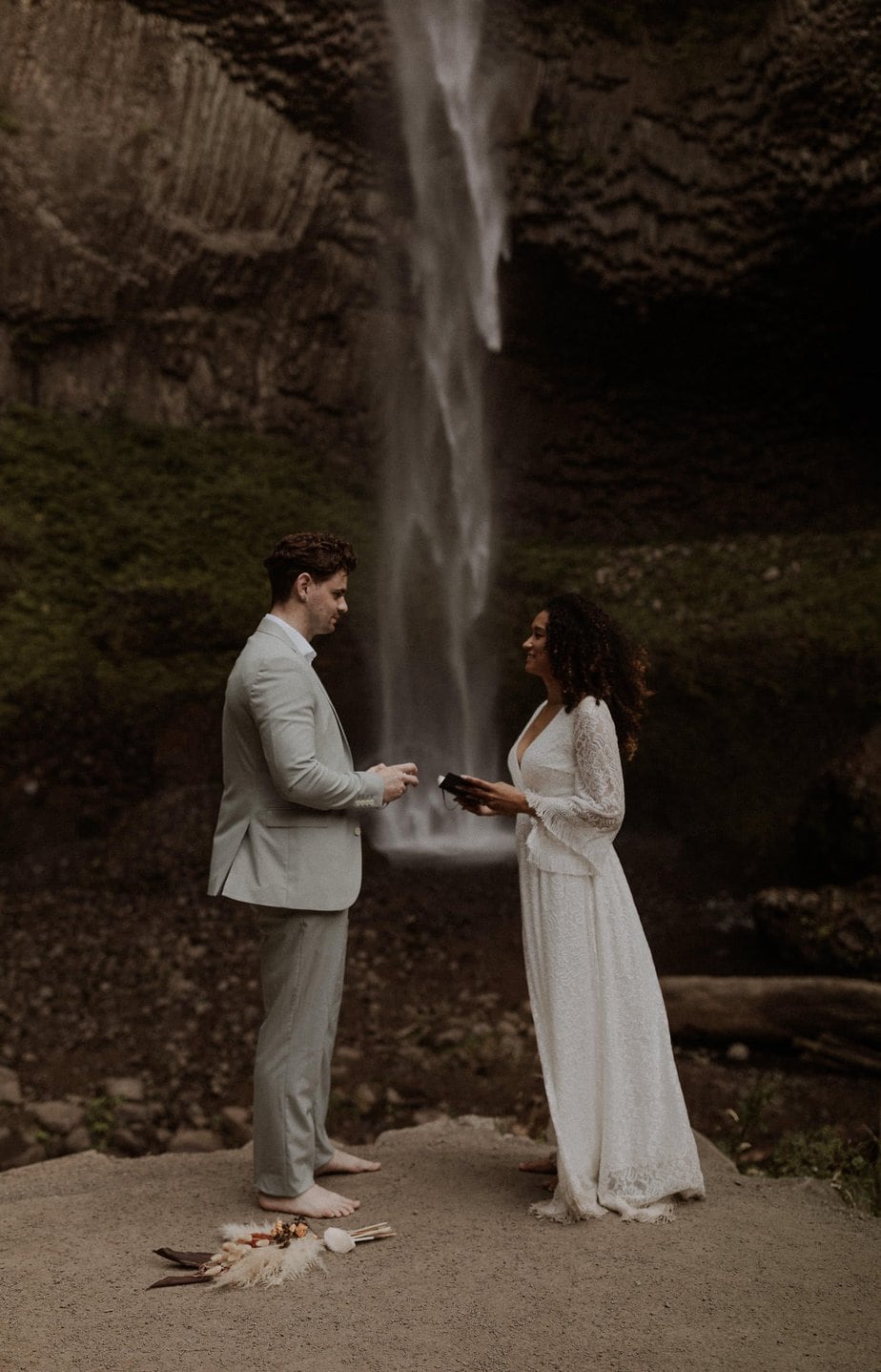 Oregon waterfall elopement at Latourell Falls, bride and groom exchange handwritten vows