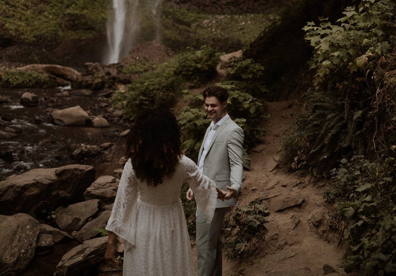 Groom sees his bride for the first time on their elopement day at Latourell Falls