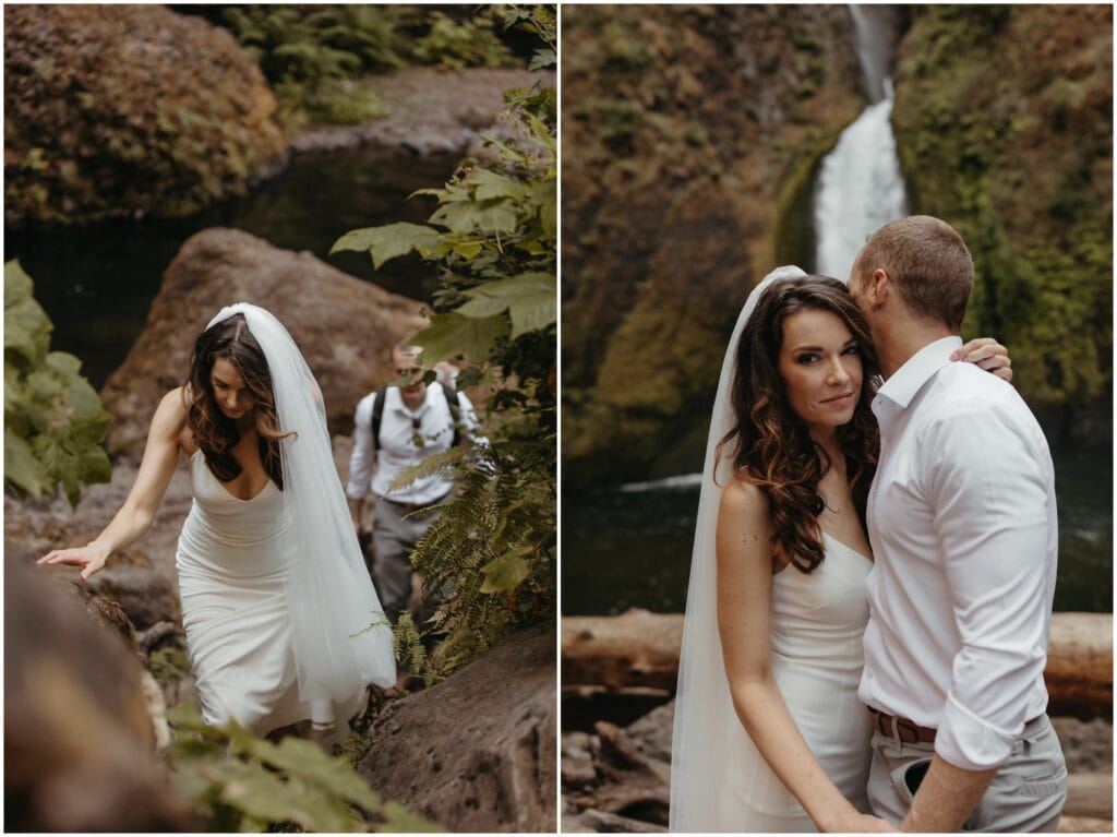 Wedding couple climbs up rocks while wearing long veil