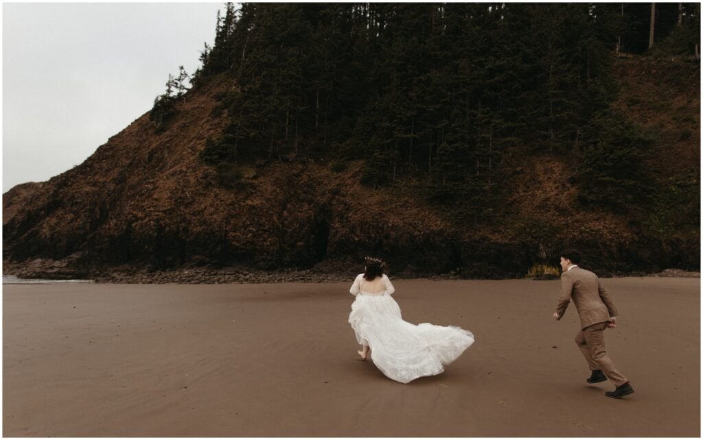 Bride and groom run across Indian Beach after their ceremony