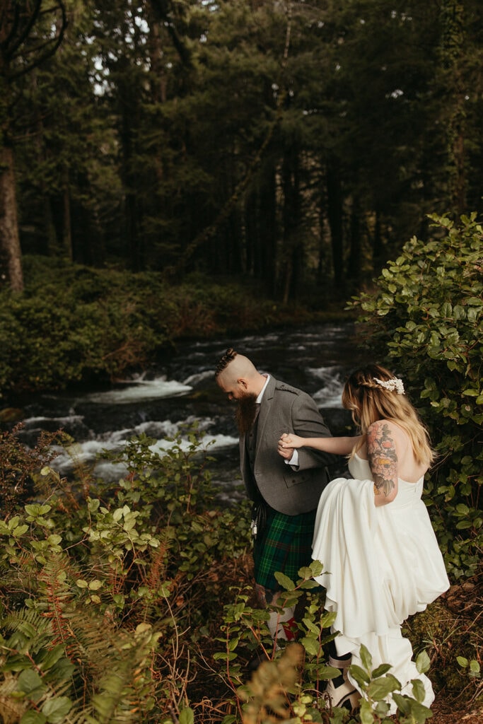 bride and groom's first look in forest at Thor's Well