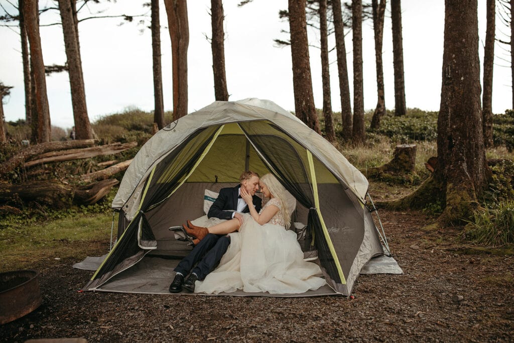 bride and groom inside tent 