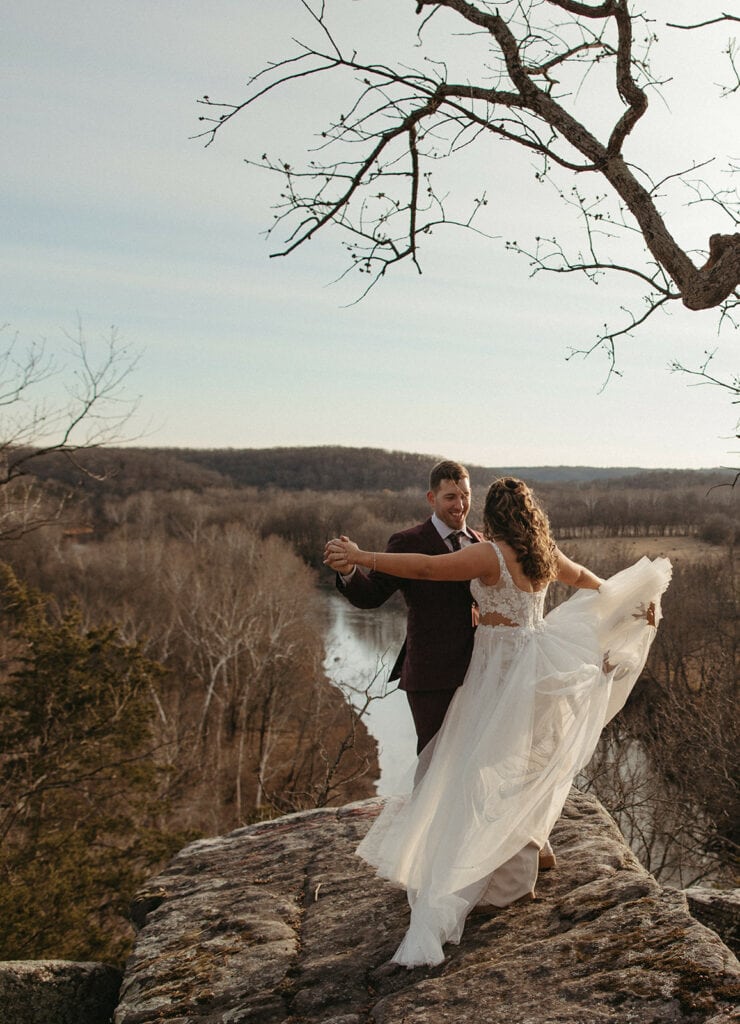 couple standing cliffside for their Missouri elopement couple photos