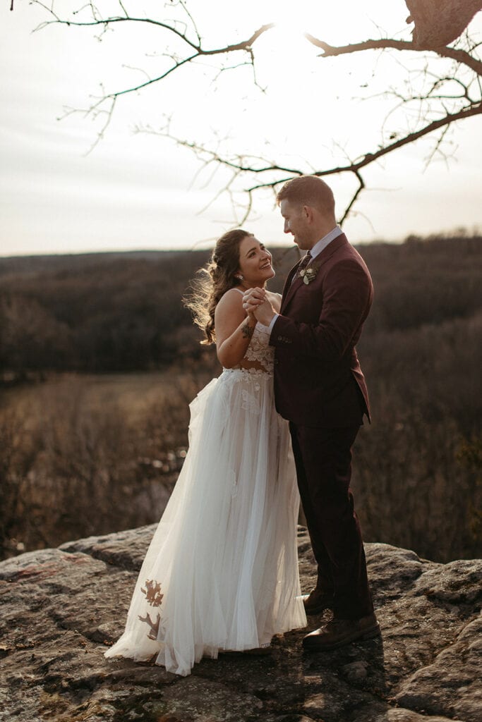 couple standing cliffside for their Missouri elopement couple photos