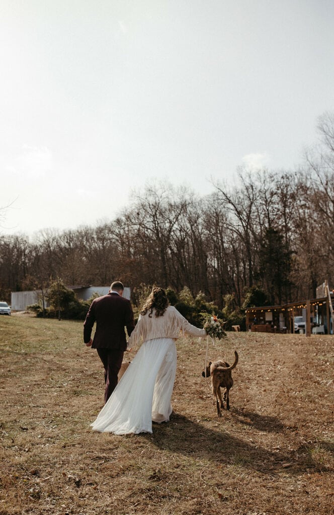 bride and groom walk together hand in hand after their Missouri elopement ceremony