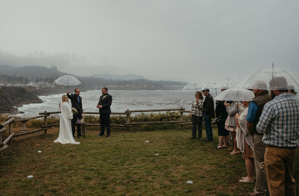 Rainy moments beautifully captured during Katie and Chris's elopement in Oregon with clear umbrellas.