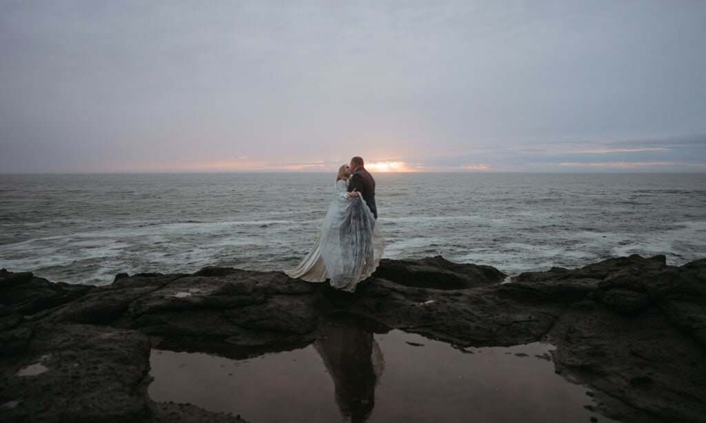 cliffside couples portraits for an elopement in Oregon at sunset