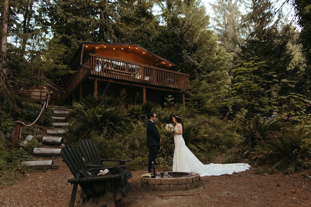 bride and groom reading personal vows during their airbnb elopement