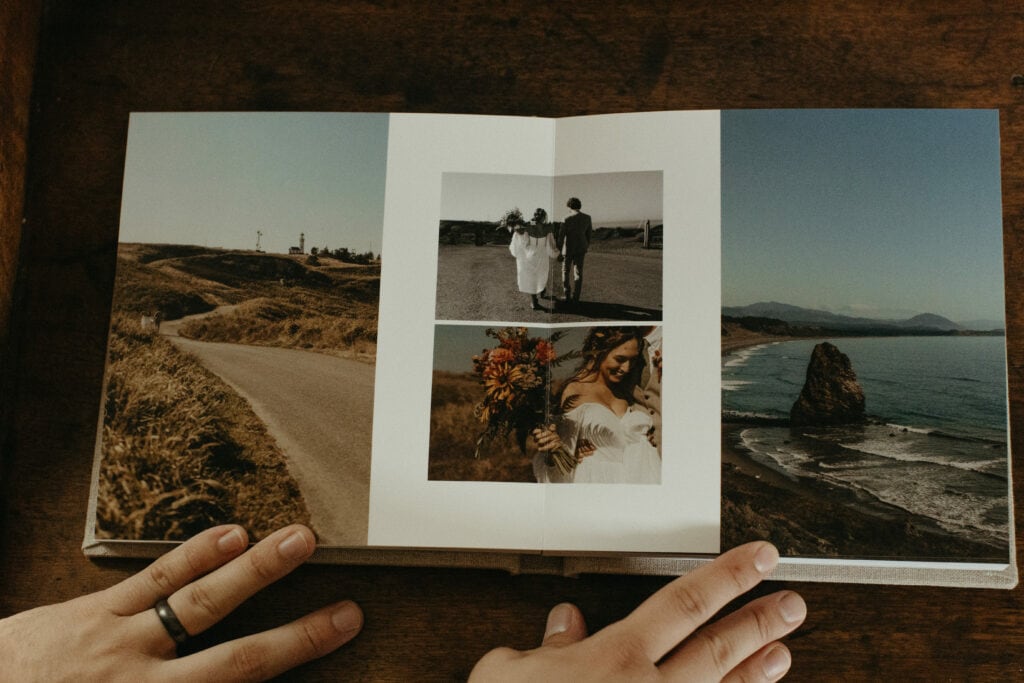 PNW elopement photographer flips through a wedding album