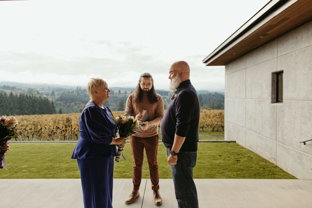 Officiant leads winery elopement ceremony