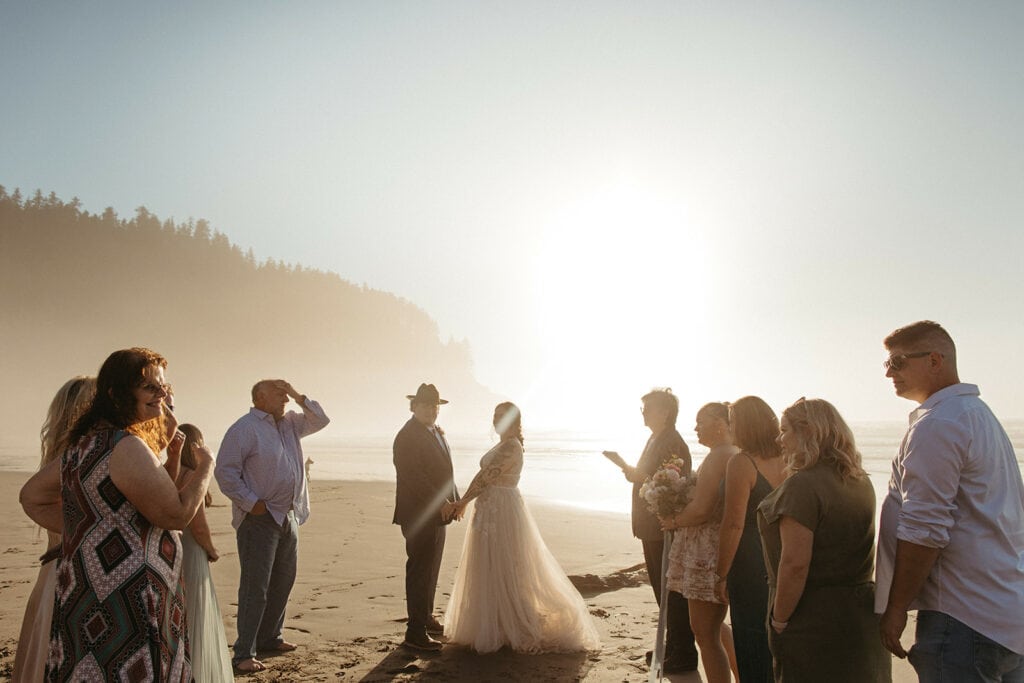 A sunset beach wedding ceremony in Oregon