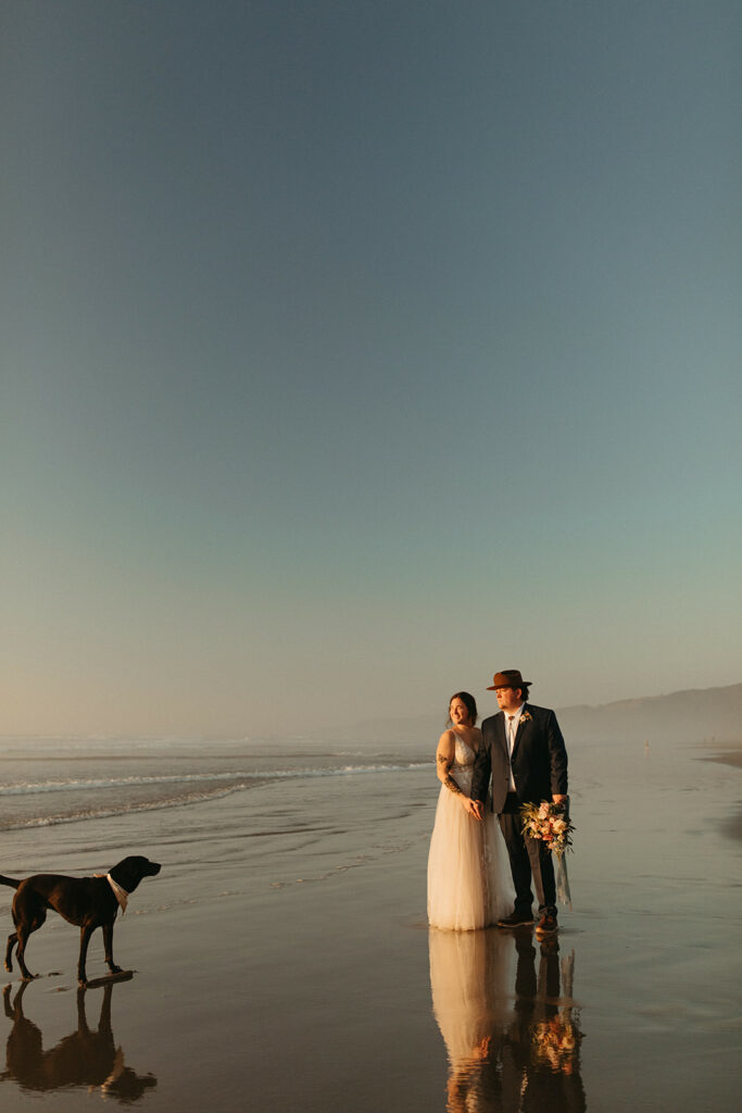 Sunset beach wedding portraits at blue hour